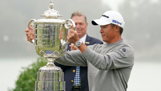 Collin Morikawa celebrates with the Wanamaker Trophy after winning the 2020 PGA Championship golf tournament at TPC Harding Park.